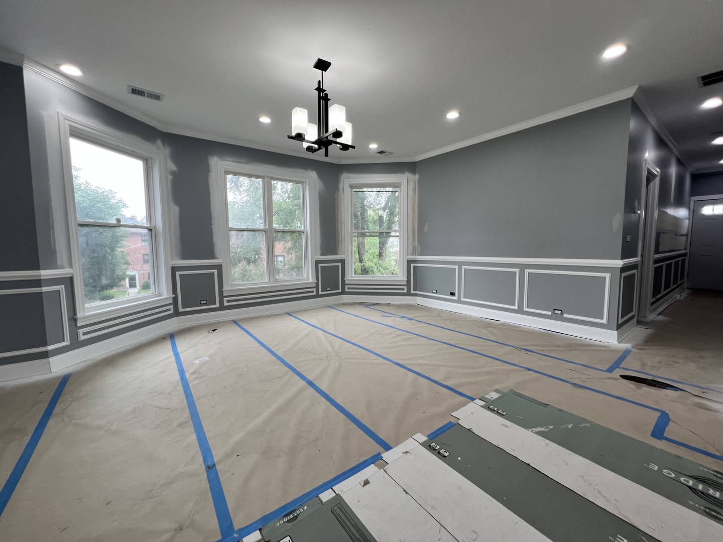 600 North Pine Avenue Chicago, IL 60644 - Photo 14 of 21 a spacious bedroom with a large bed and a chandelier