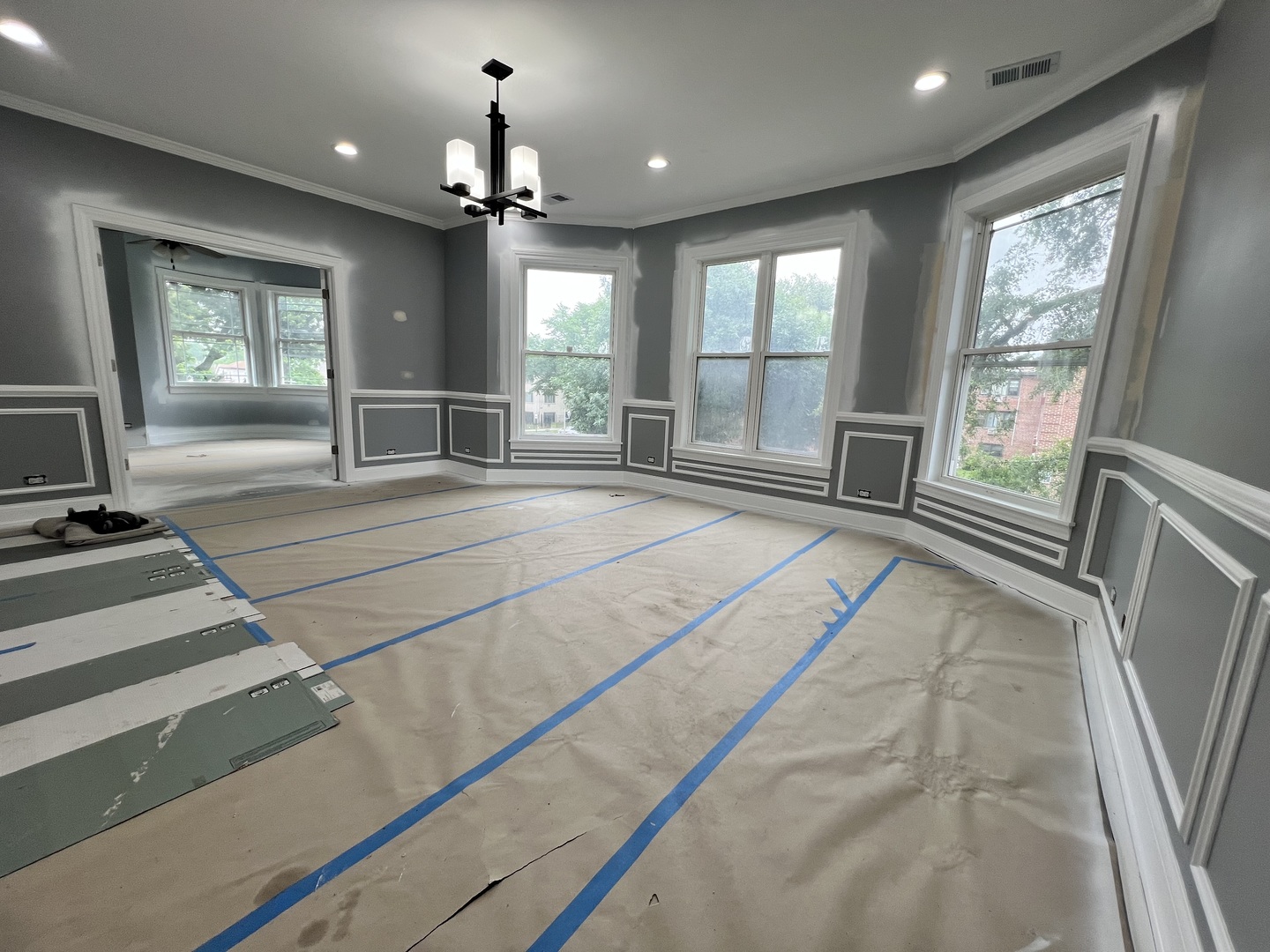 600 North Pine Avenue Chicago, IL 60644 - Photo 15 of 21 a spacious bedroom with a large bed and a chandelier