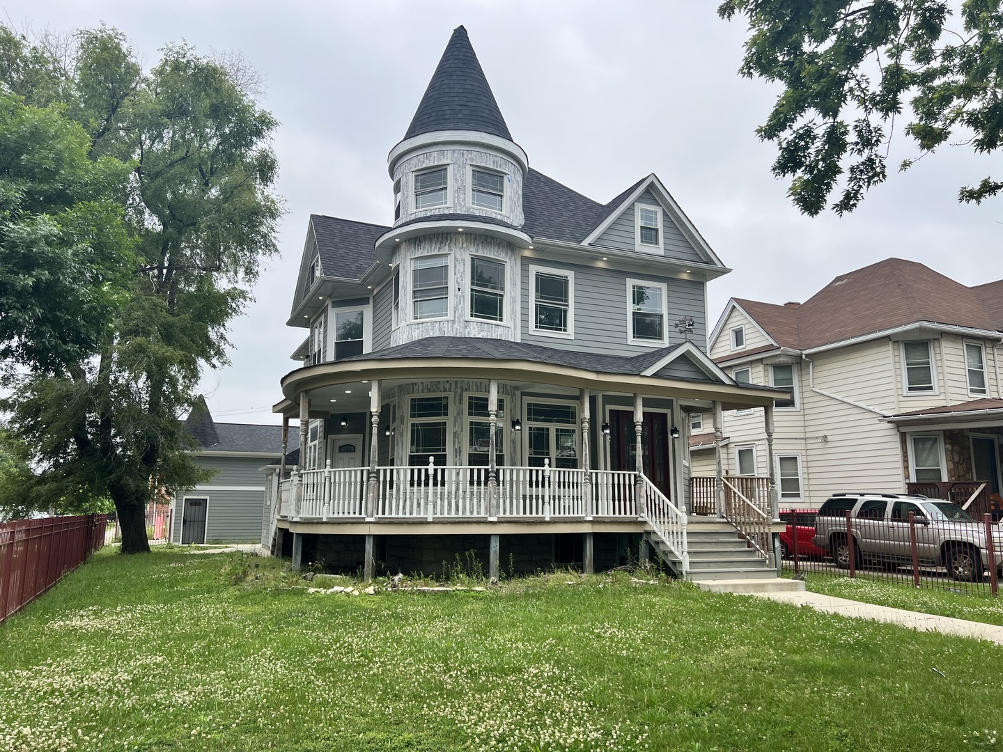 600 North Pine Avenue Chicago, IL 60644 - Photo 2 of 21 a front view of a house with a garden