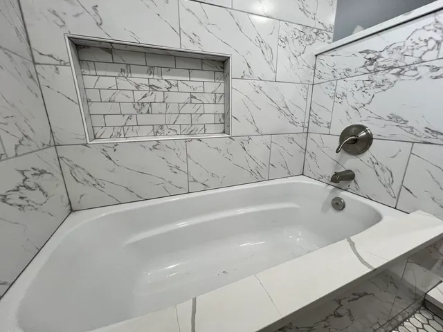a bathroom with a bathtub