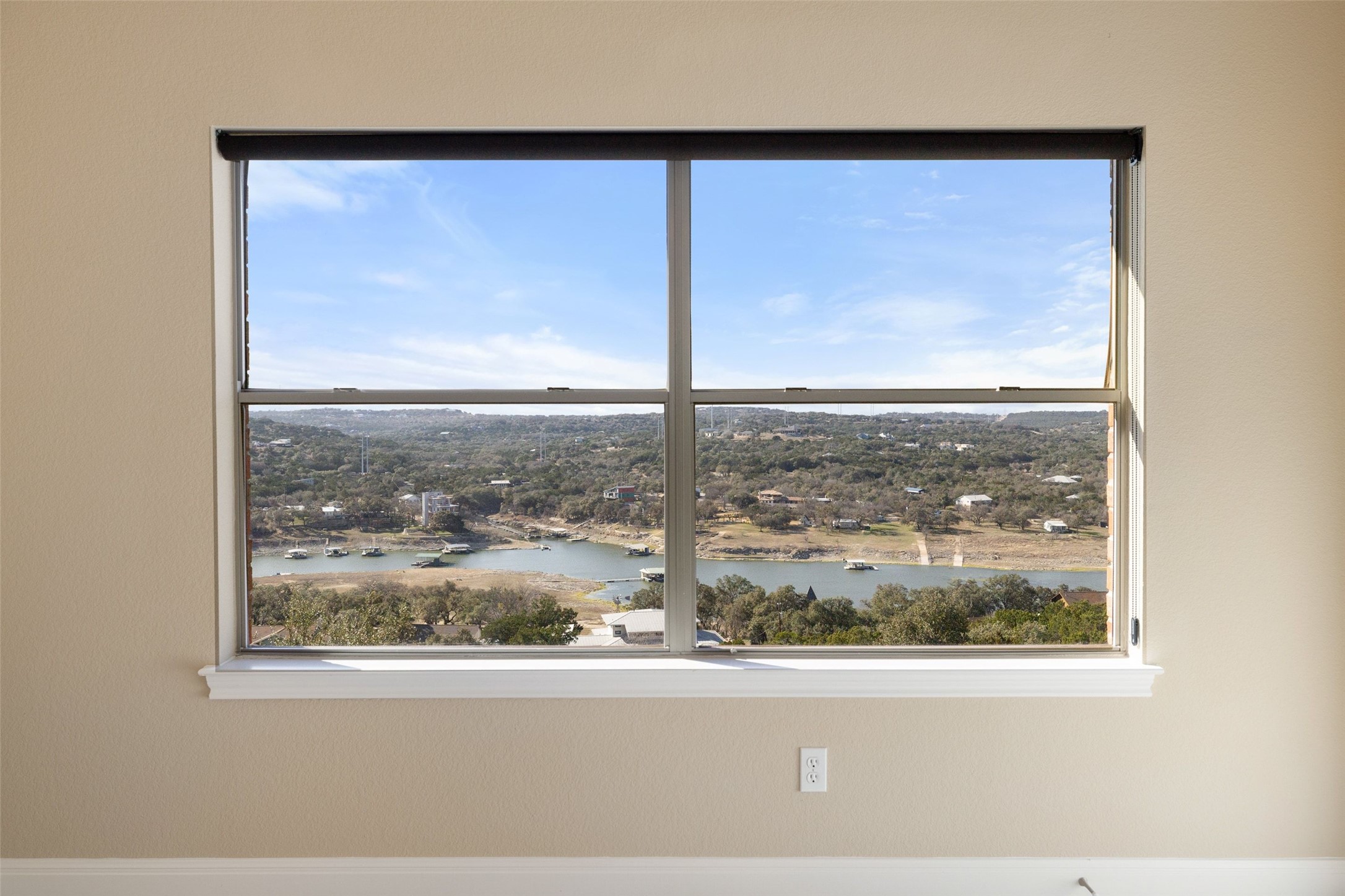 2702 Lakehurst Road Spicewood, TX 78669 - Photo 29 of 40 Incredible lake and hill country views for your guests to enjoy from the secondary bedrooms.