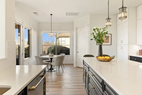 a dining room with furniture potted plants