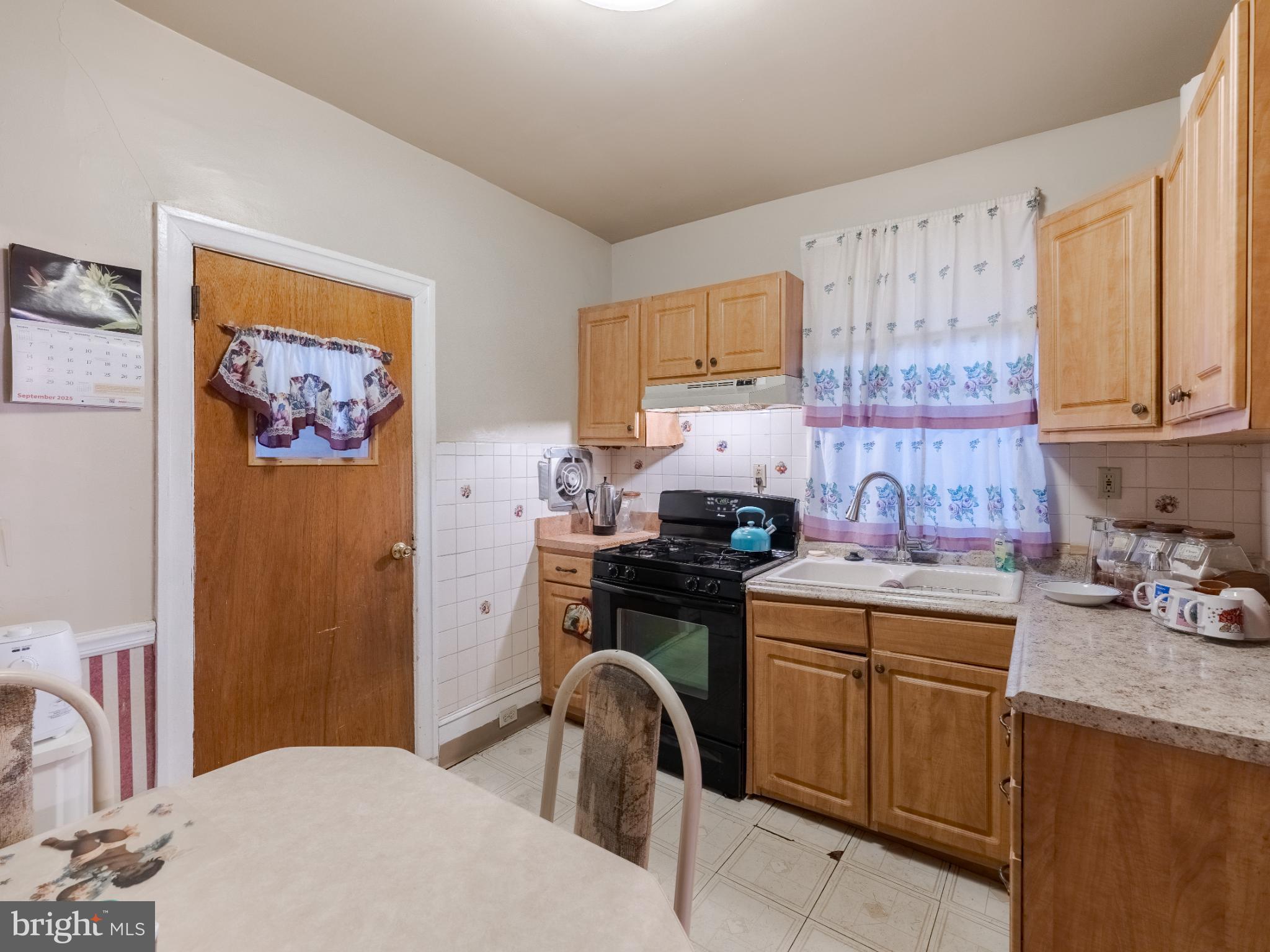 5329 Willows Avenue Philadelphia, PA 19143 - Photo 14 of 32 Cozy kitchen with warm wooden accents.