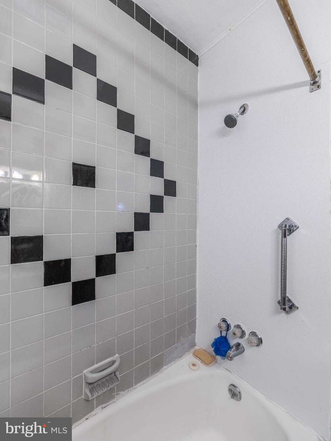 5329 Willows Avenue Philadelphia, PA 19143 - Photo 22 of 32 Stylish black and white tiled shower space.