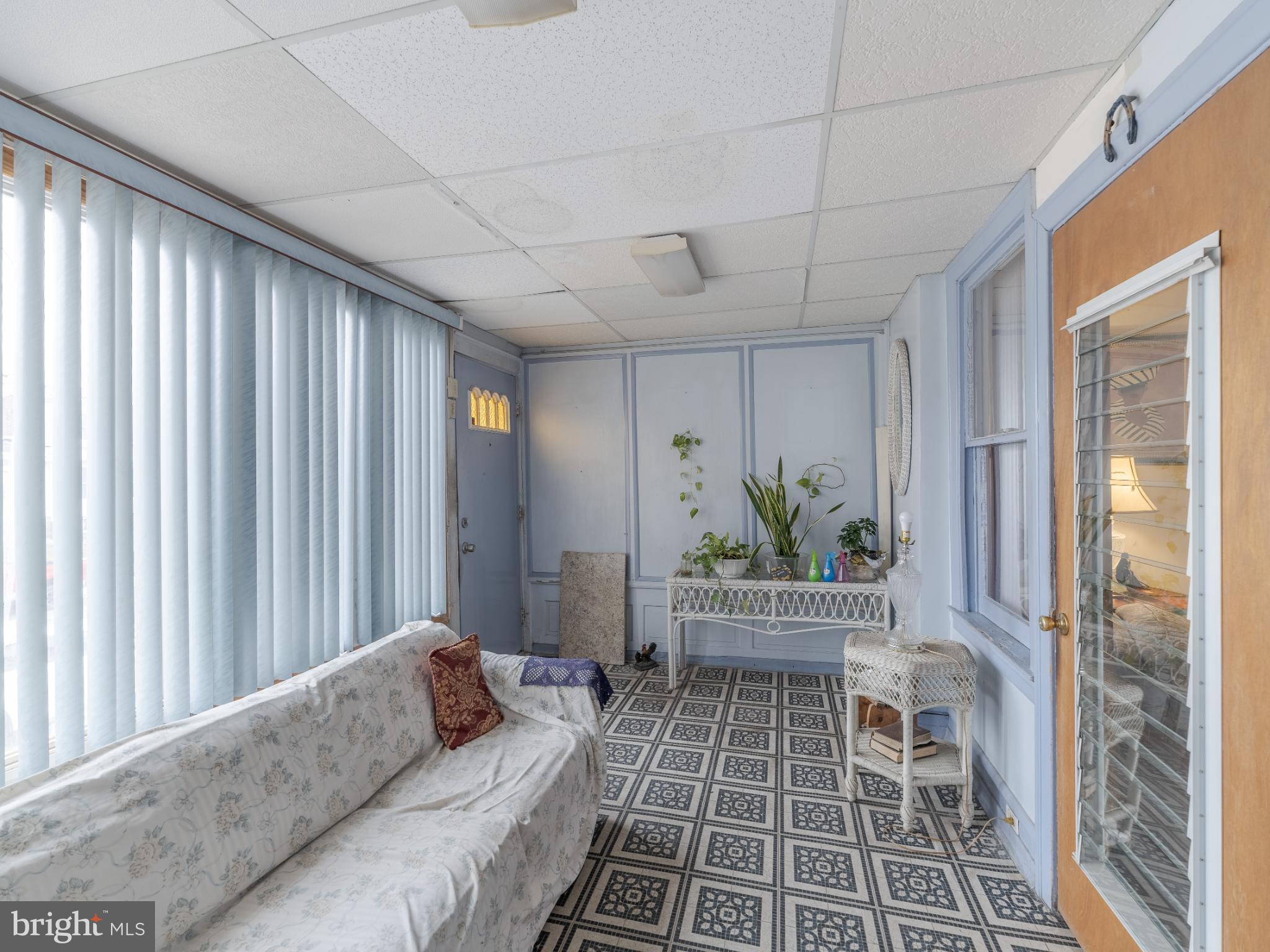 5329 Willows Avenue Philadelphia, PA 19143 - Photo 3 of 32 Bright sunroom with charming tile flooring.