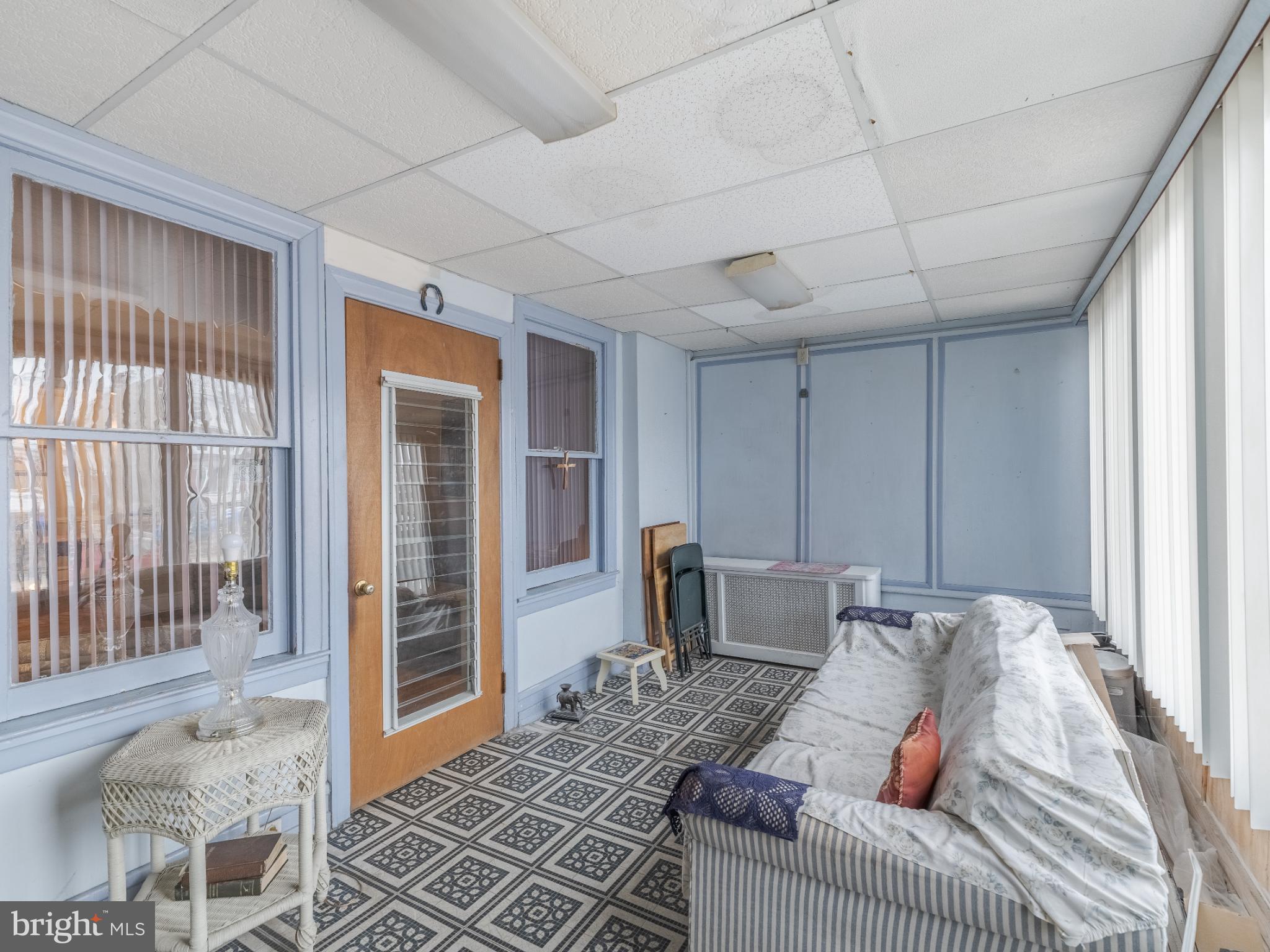 5329 Willows Avenue Philadelphia, PA 19143 - Photo 4 of 32 Bright and airy sunroom with charming details.