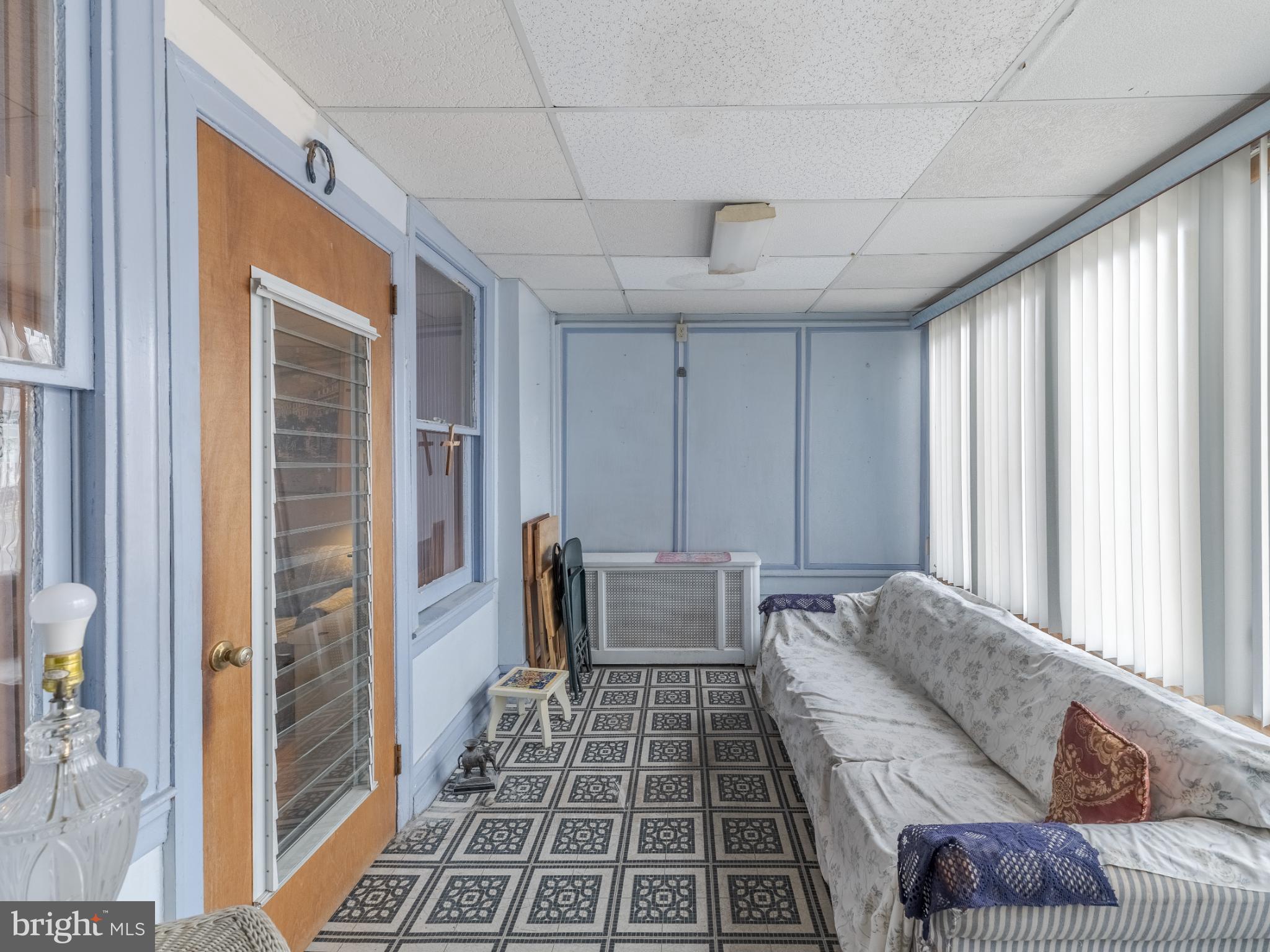 5329 Willows Avenue Philadelphia, PA 19143 - Photo 5 of 32 Bright and airy sunroom with charming details.