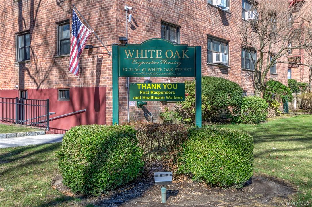 50 White Oak Street, Unit 3G New Rochelle, NY 10801 - Photo 1 of 16 a sign on the side of a building