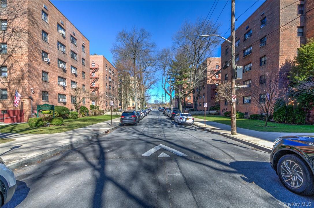 50 White Oak Street, Unit 3G New Rochelle, NY 10801 - Photo 16 of 16 a street view with a building and trees in the background