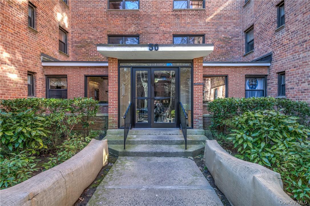 50 White Oak Street, Unit 3G New Rochelle, NY 10801 - Photo 2 of 16 a view of a building with potted plants