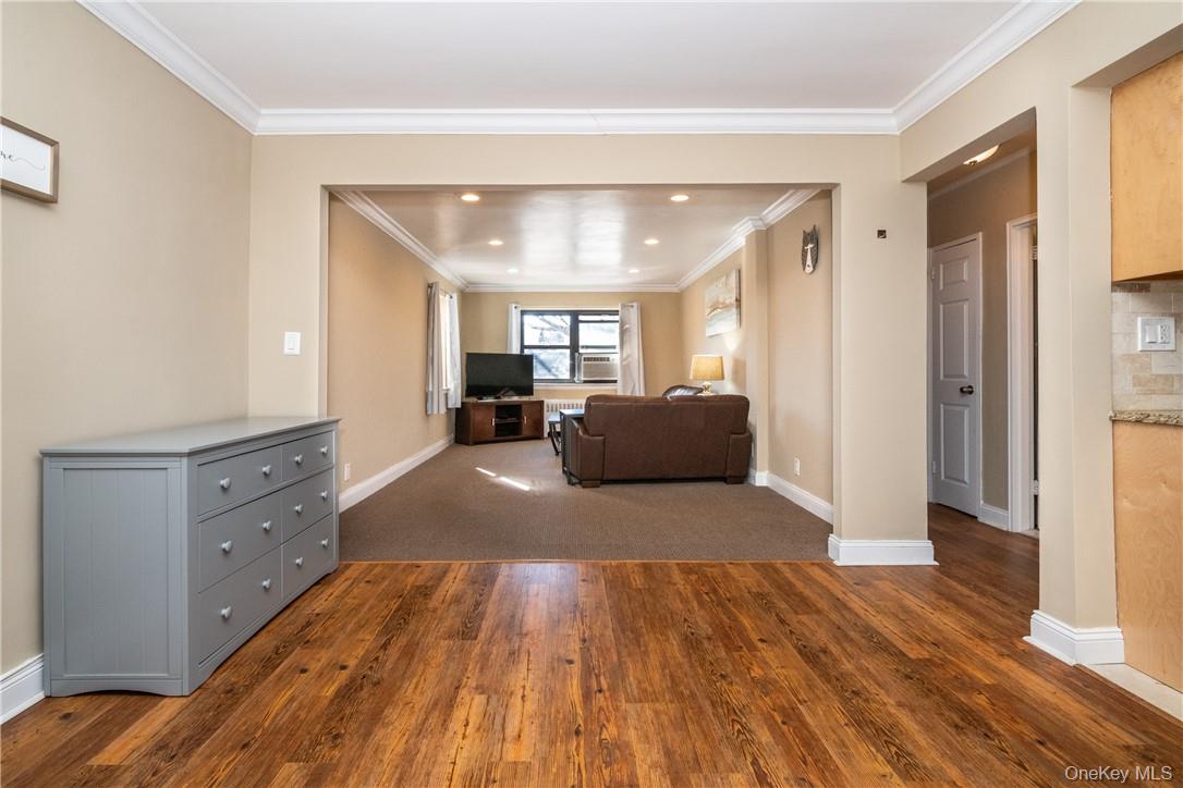 50 White Oak Street, Unit 3G New Rochelle, NY 10801 - Photo 6 of 16 a living room with furniture and a wooden floor