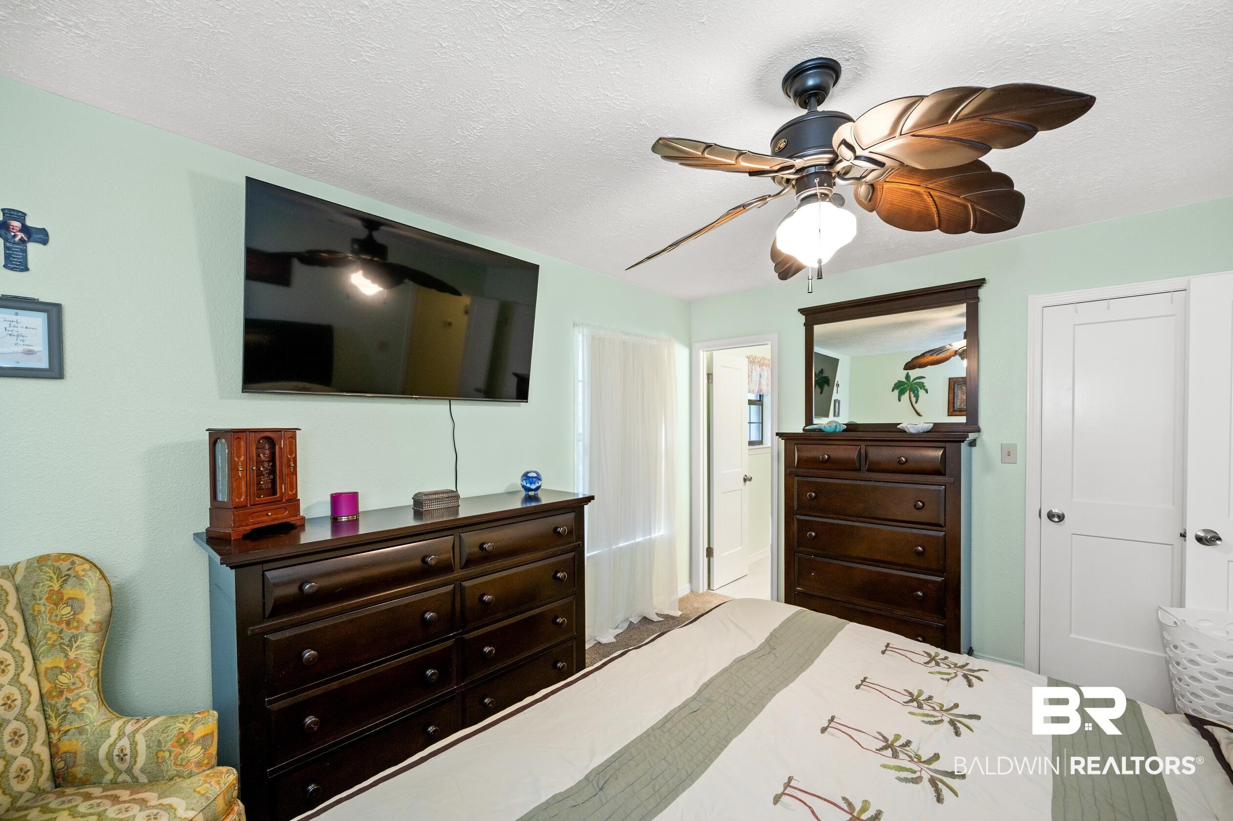 2772 Santa Rosa Circle Lillian, AL 36549 - Photo 17 of 50 Bedroom featuring a textured ceiling and ceiling fan