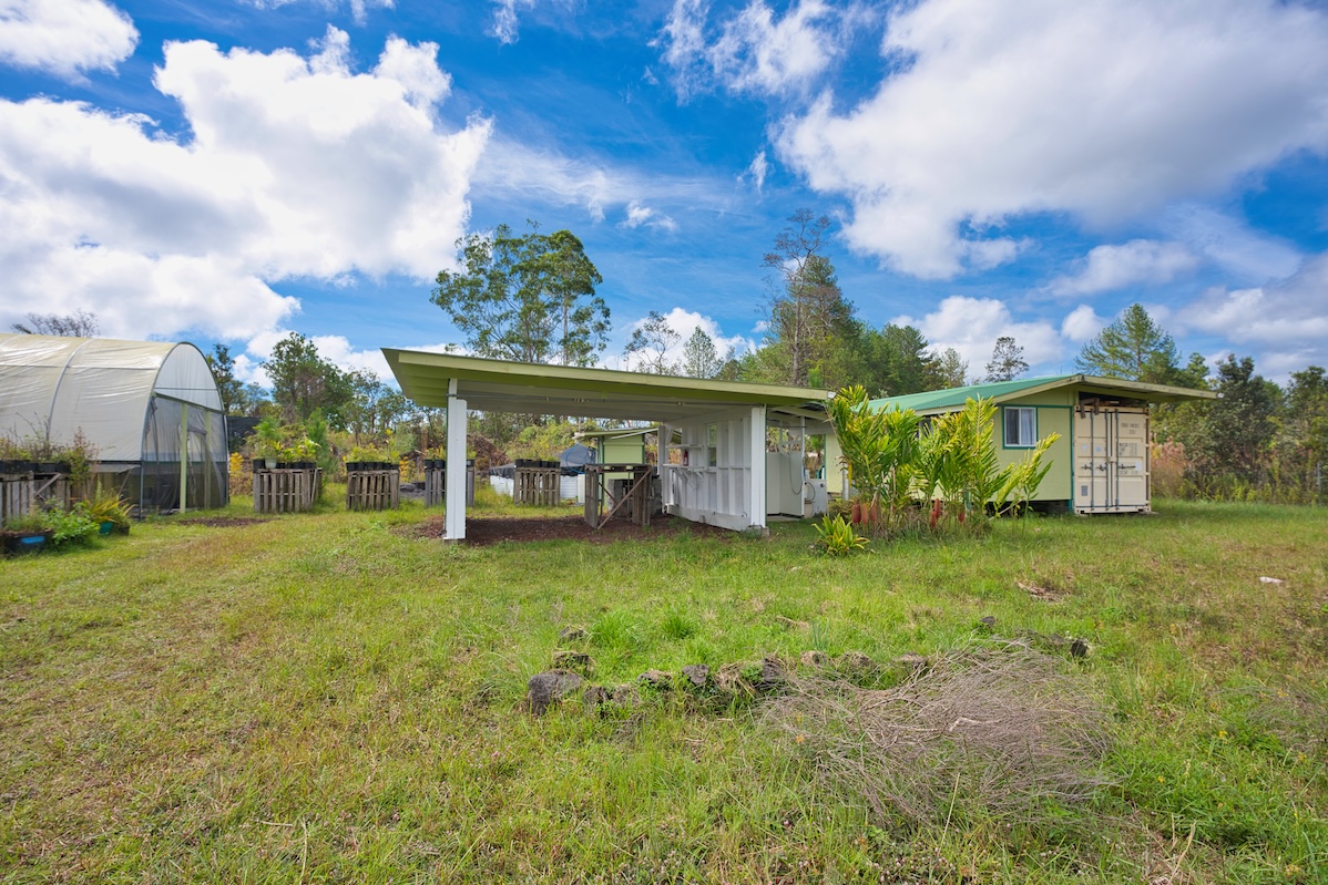 11-1984 Ohialani Road Mountain View, HI 96771 - Photo 14 of 19 a view of a house with backyard and garden
