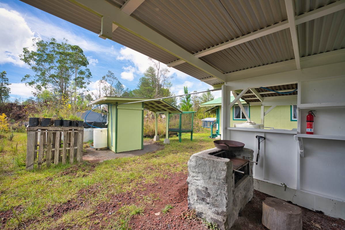 11-1984 Ohialani Road Mountain View, HI 96771 - Photo 15 of 19 a view of a backyard with table and chairs