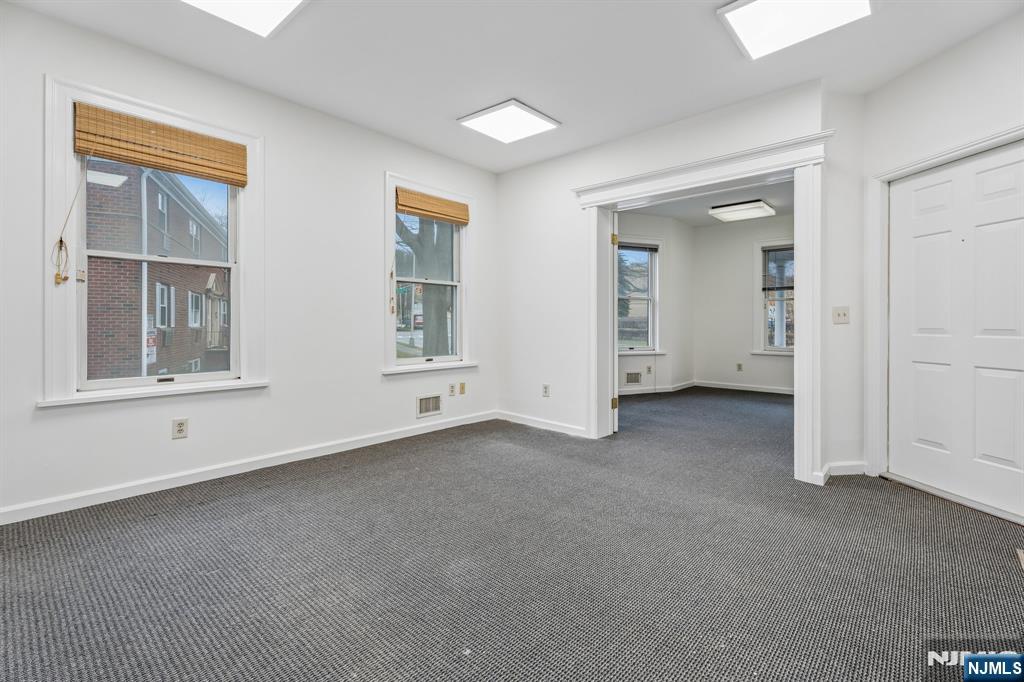94 Church Street Montclair, NJ 07042 - Photo 11 of 49 an empty room with windows and closet