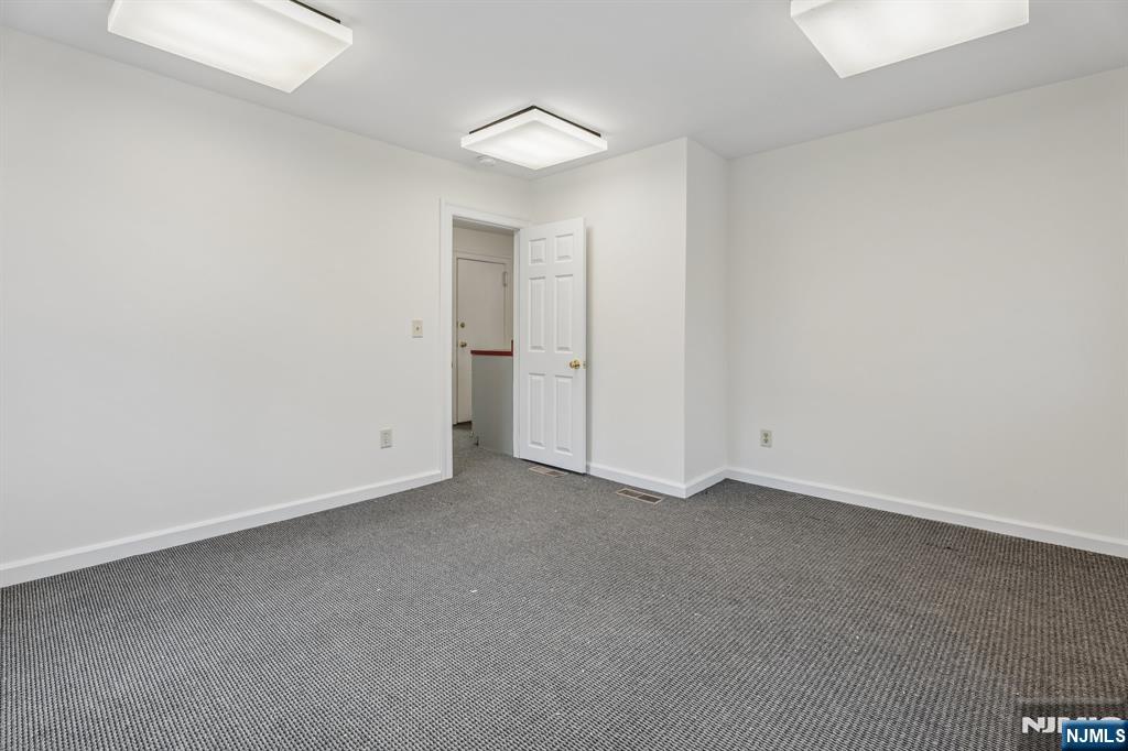94 Church Street Montclair, NJ 07042 - Photo 18 of 49 an empty room with closet and a window