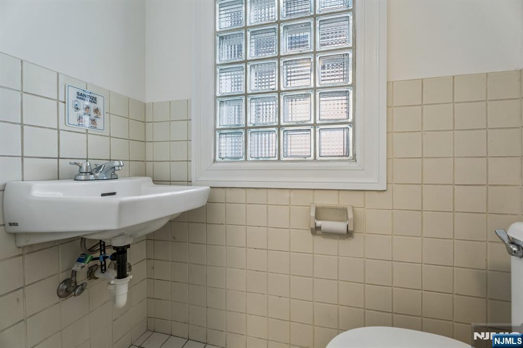 94 Church Street Montclair, NJ 07042 - Photo 20 of 49 a bathroom with a sink a window and shower