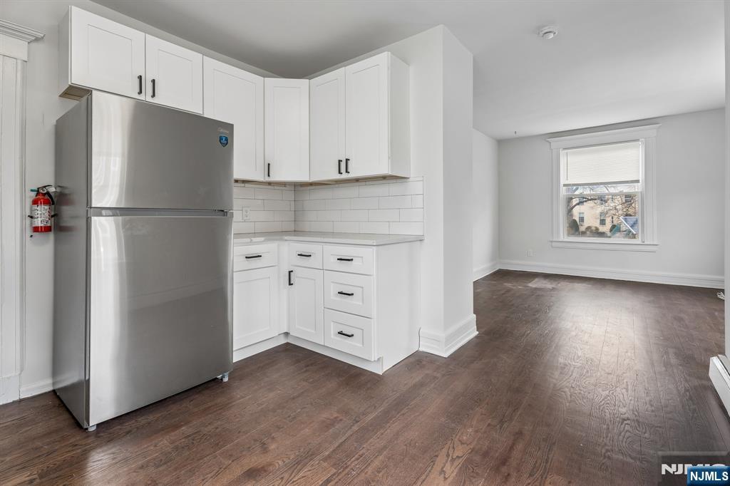 94 Church Street Montclair, NJ 07042 - Photo 21 of 49 a white refrigerator freezer sitting inside of a kitchen