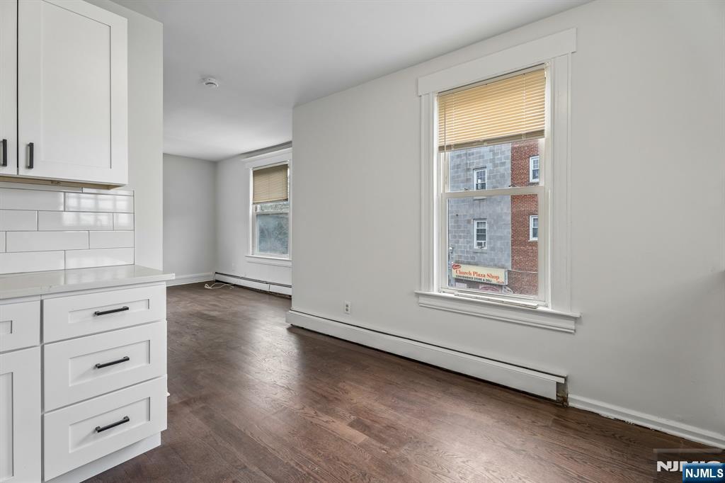 94 Church Street Montclair, NJ 07042 - Photo 23 of 49 an empty room with windows and closet