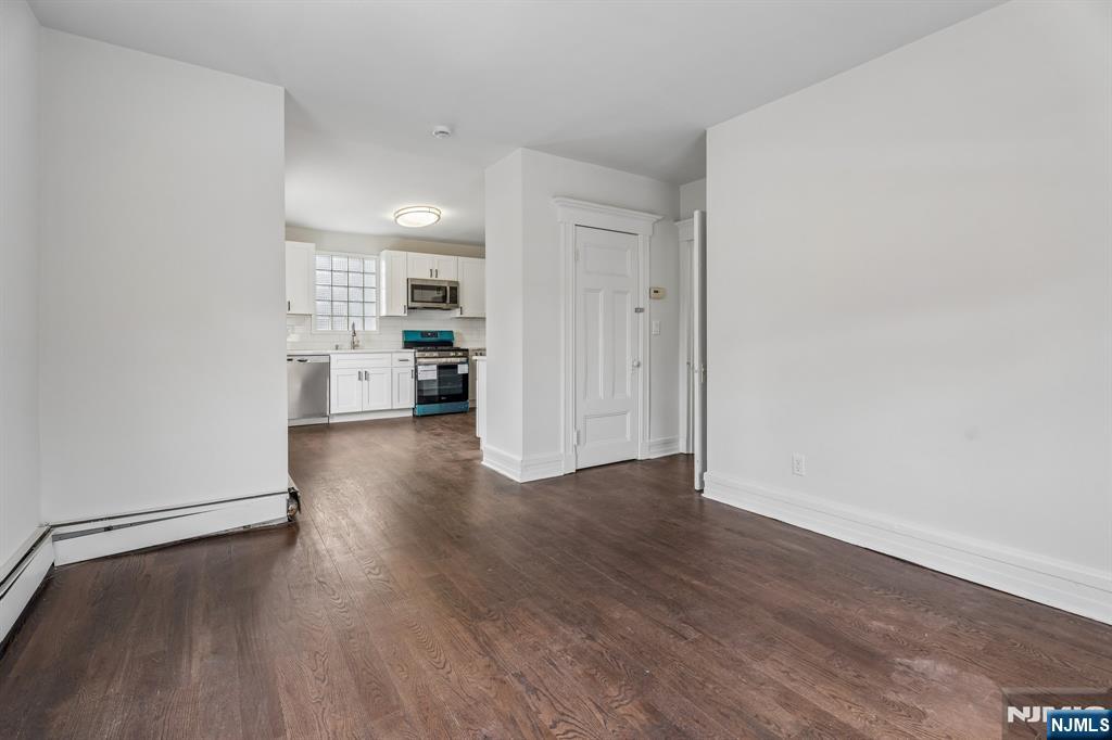 94 Church Street Montclair, NJ 07042 - Photo 25 of 49 wooden floor in an empty room with a window