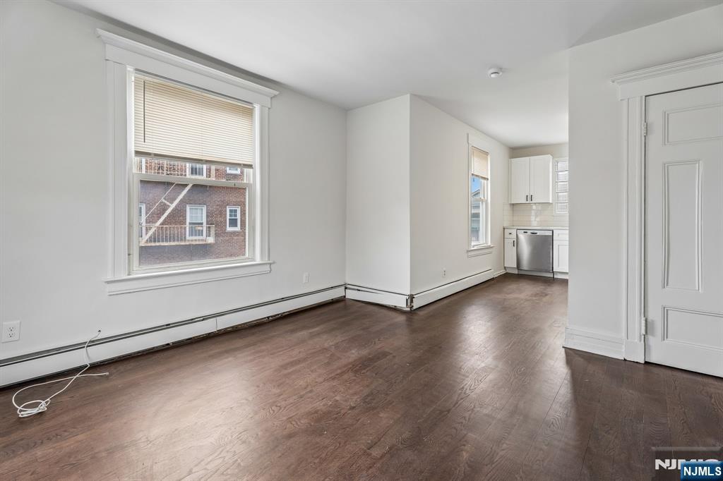 94 Church Street Montclair, NJ 07042 - Photo 26 of 49 an empty room with wooden floor and windows