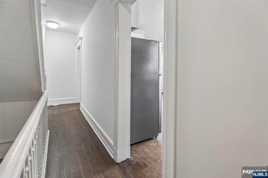 94 Church Street Montclair, NJ 07042 - Photo 28 of 49 a view of a hallway with wooden floor