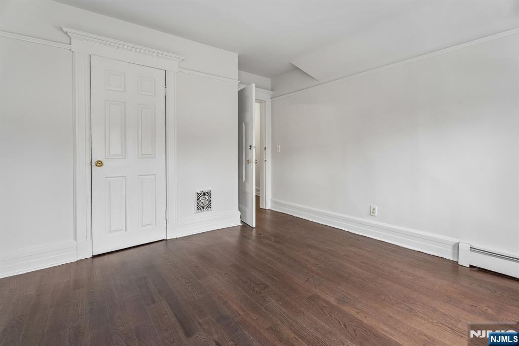 94 Church Street Montclair, NJ 07042 - Photo 32 of 49 a view of an empty room with wooden floor