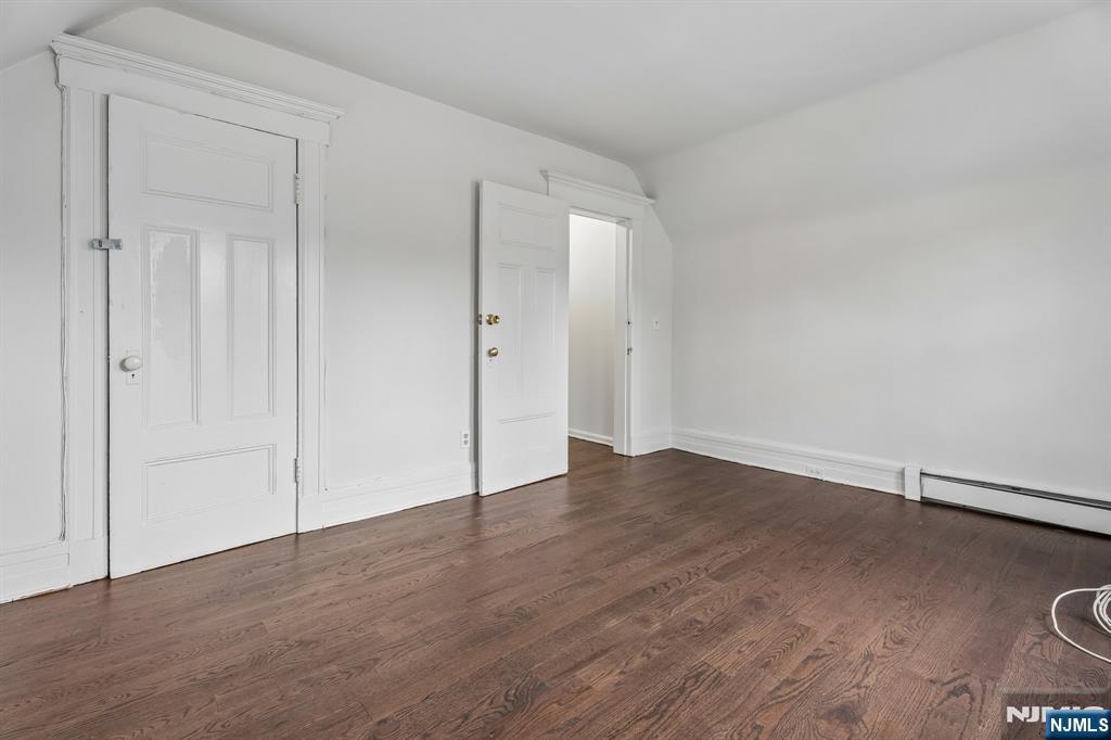 94 Church Street Montclair, NJ 07042 - Photo 34 of 49 a view of an empty room with wooden floor