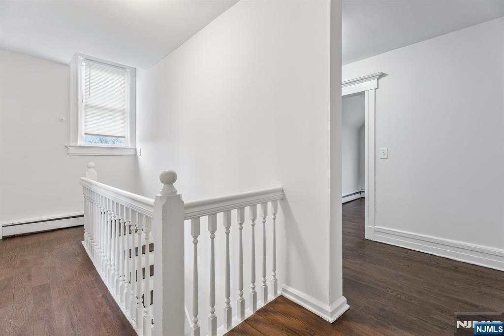 94 Church Street Montclair, NJ 07042 - Photo 37 of 49 a view of a hallway with wooden floor and entryway