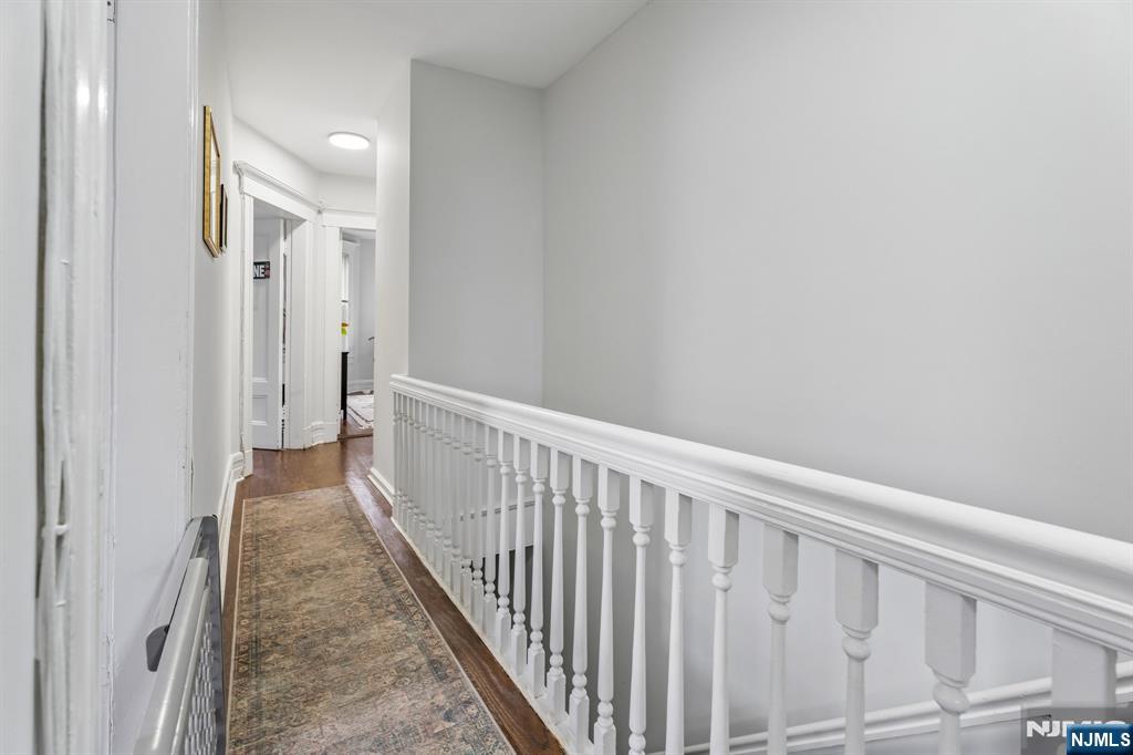 94 Church Street Montclair, NJ 07042 - Photo 39 of 49 a view of a hallway with wooden floor
