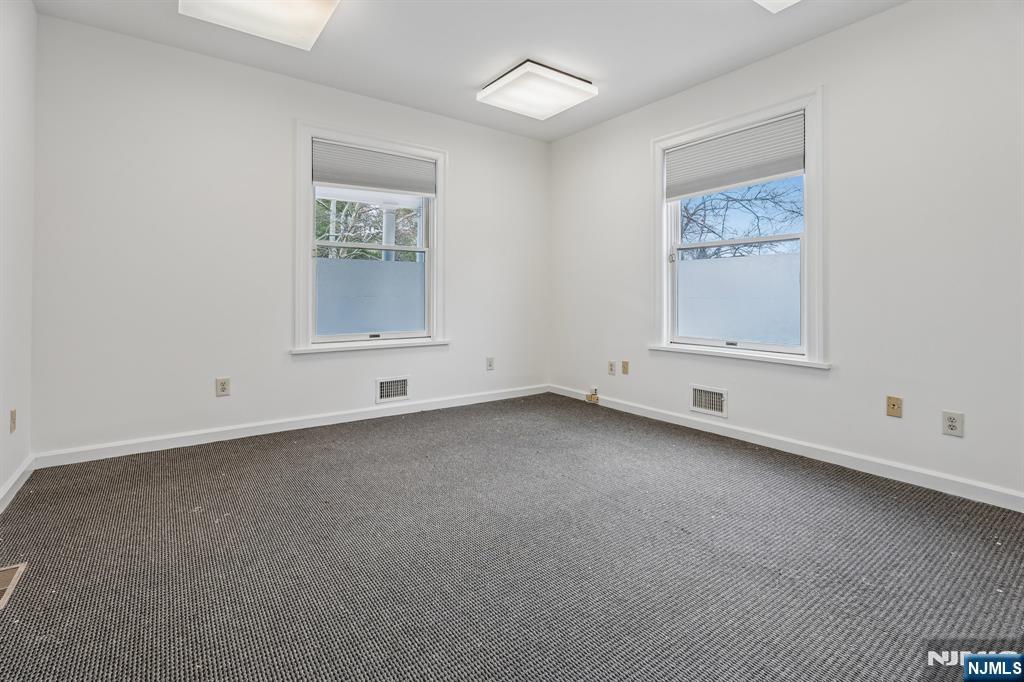94 Church Street Montclair, NJ 07042 - Photo 4 of 49 an empty room with a window