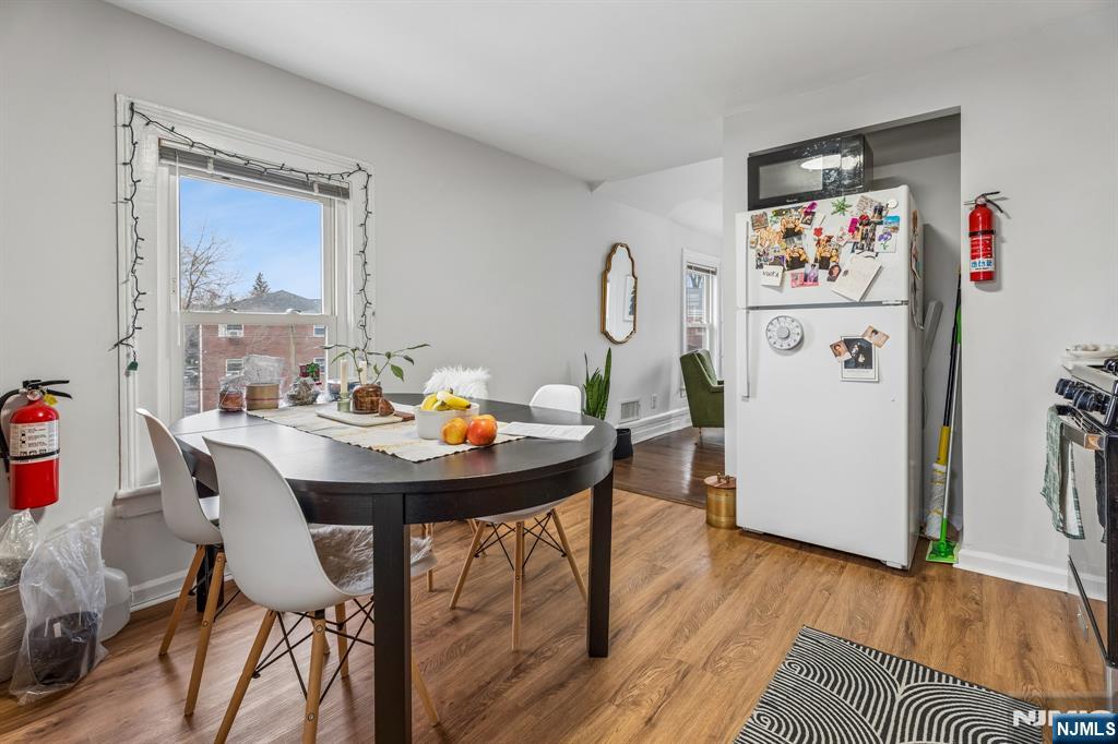 94 Church Street Montclair, NJ 07042 - Photo 43 of 49 a view of a dining room with furniture a chandelier and wooden floor
