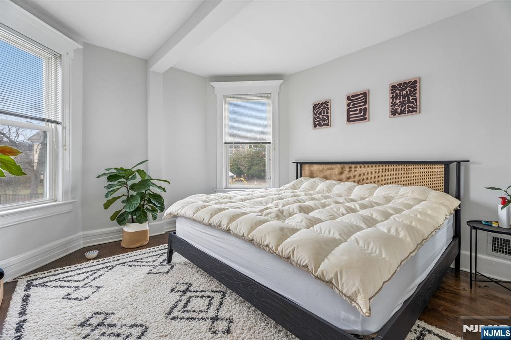 94 Church Street Montclair, NJ 07042 - Photo 46 of 49 a large bed sitting in a bedroom next to a window