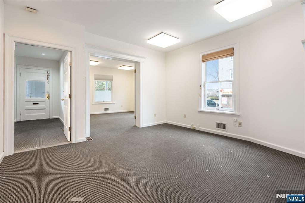 94 Church Street Montclair, NJ 07042 - Photo 8 of 49 an empty room with a window and a bathroom