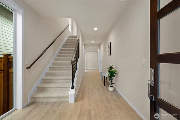 a view of entryway with wooden floor