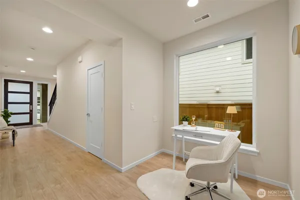 a room with furniture a rug and a window