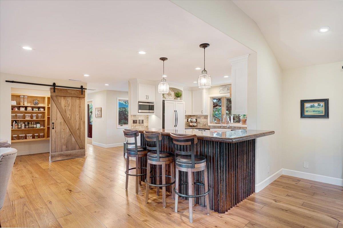 7409 Hihn Road Ben Lomond, CA 95005 - Photo 25 of 101 a view of a a dining room with furniture window and wooden floor