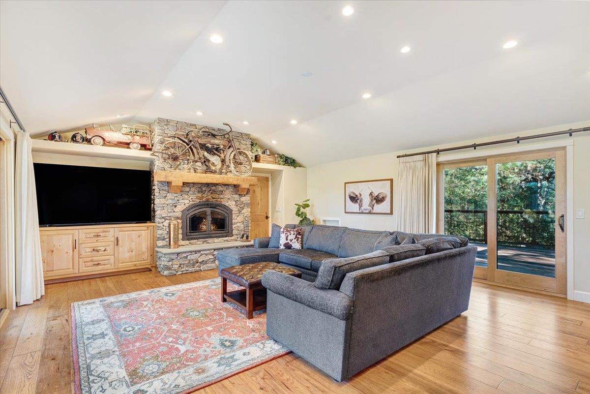 7409 Hihn Road Ben Lomond, CA 95005 - Photo 30 of 101 a living room with furniture a flat screen tv and a fireplace