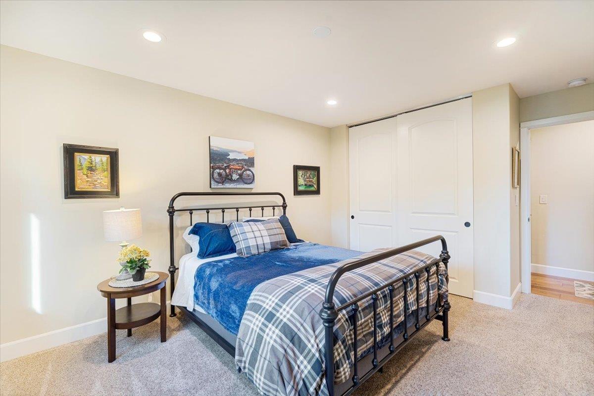 7409 Hihn Road Ben Lomond, CA 95005 - Photo 55 of 101 a bedroom with a bed and a painting on the wall