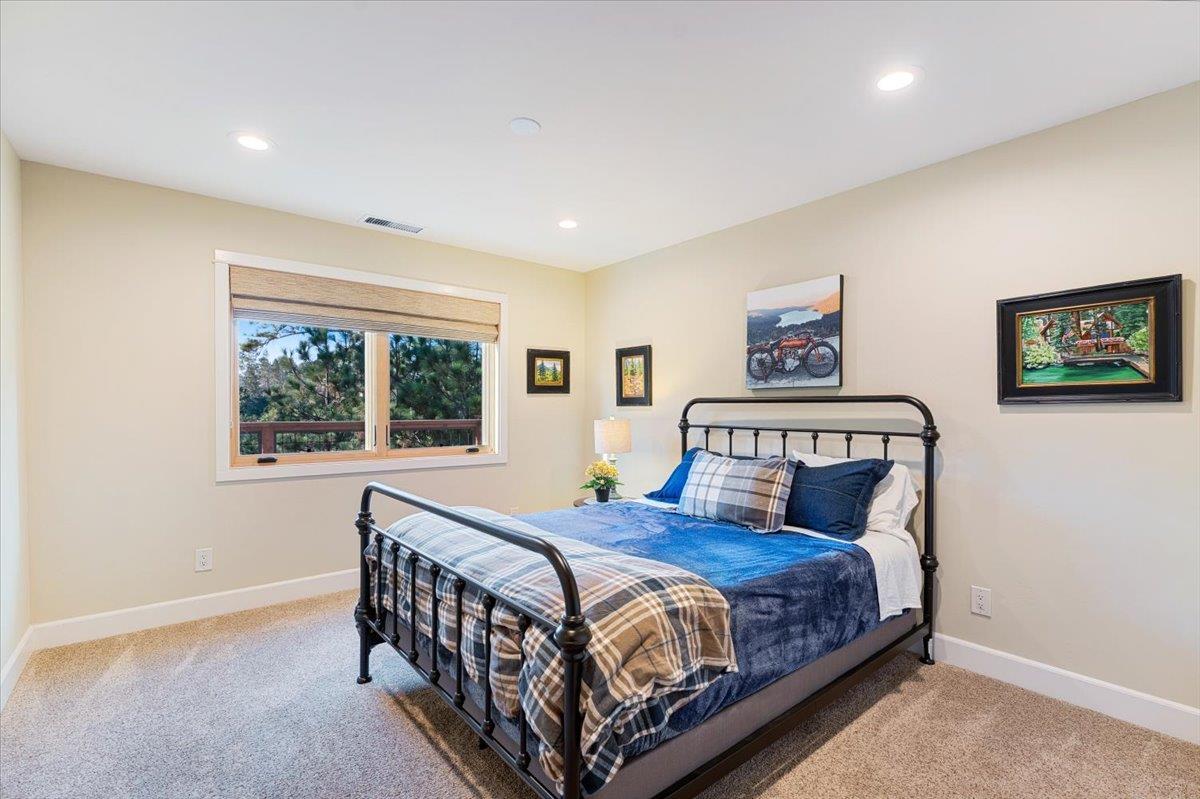 7409 Hihn Road Ben Lomond, CA 95005 - Photo 56 of 101 a bedroom with a large bed and a window