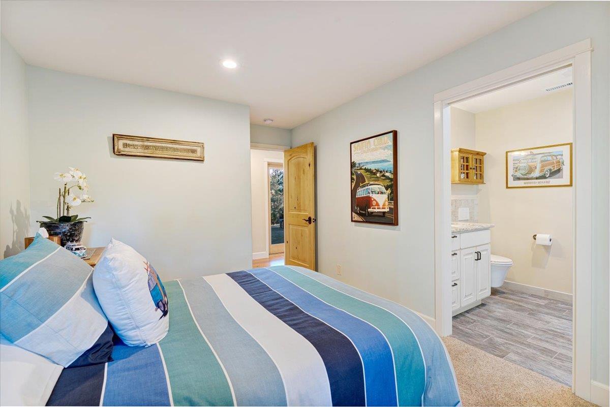 7409 Hihn Road Ben Lomond, CA 95005 - Photo 62 of 101 a bedroom with a bed and wooden floor