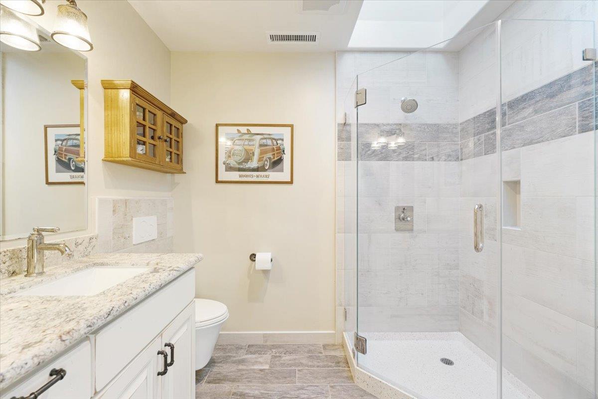 7409 Hihn Road Ben Lomond, CA 95005 - Photo 64 of 101 a bathroom with a granite countertop sink toilet and shower