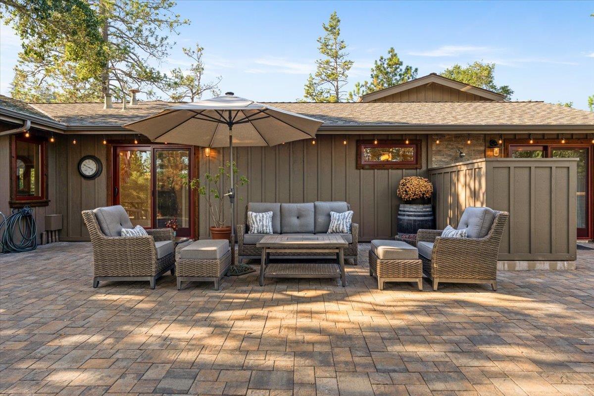 7409 Hihn Road Ben Lomond, CA 95005 - Photo 67 of 101 a view of a patio with a table and chairs under an umbrella