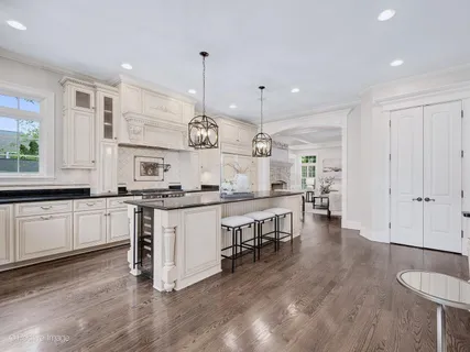 a kitchen that has a sink and a stove