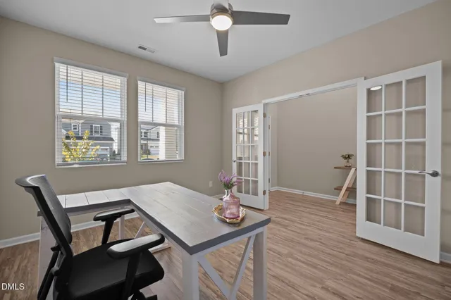 a view of a dining room with furniture and wooden floor