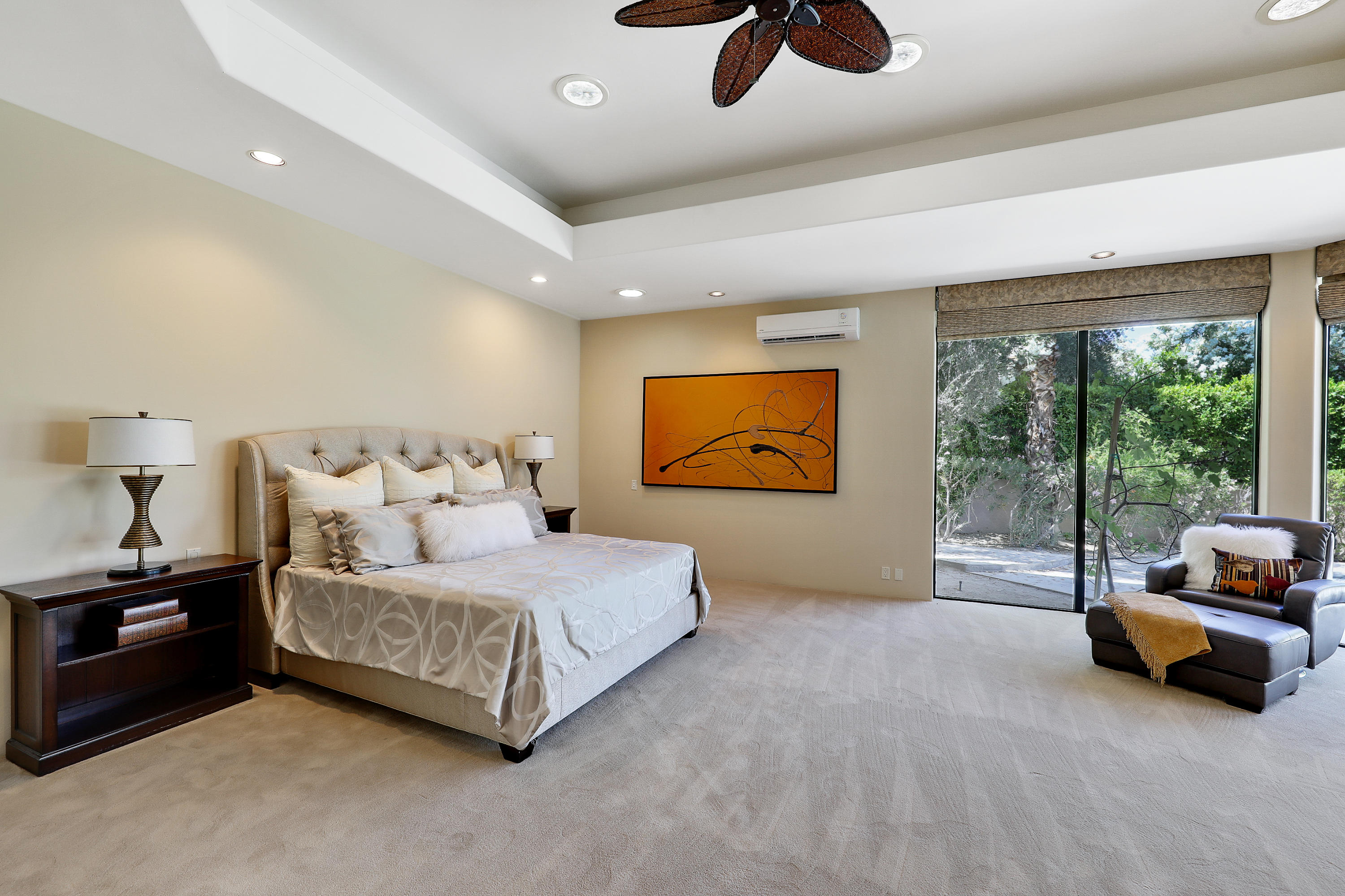 70305 Thunderbird Road Rancho Mirage, CA 92270 - Photo 22 of 27 a bedroom with furniture and a large window