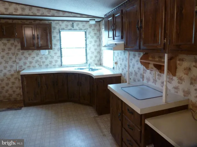 a view of a bathroom with a sink and a mirror
