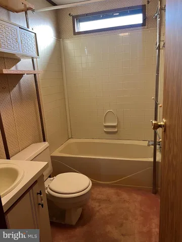 a view of grassy field with benches