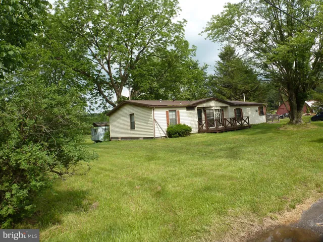 a front view of a house with swimming pool
