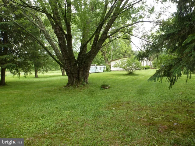 a view of front of house with a yard